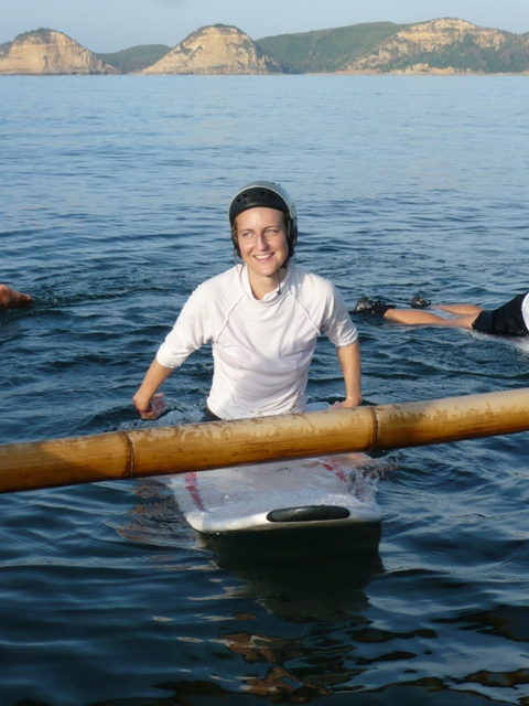 Linn on surfboard